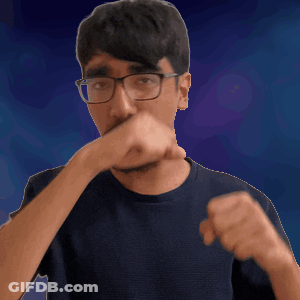 A Man Wearing Glasses Is Covering His Mouth With His Hand GIF
