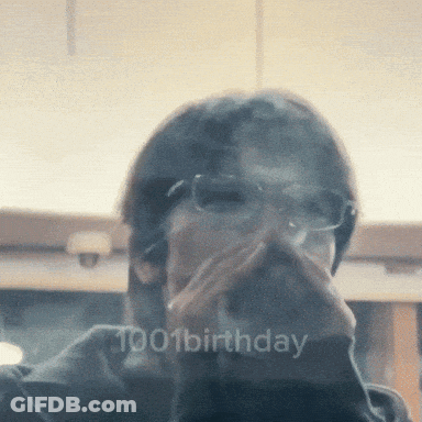 A Man Wearing Glasses Is Covering His Mouth With His Hand And The Words 1001 Birthday Are Visible In The Corner GIF