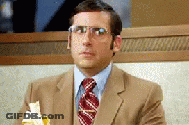 A Man Wearing Glasses Is Eating A Banana GIF