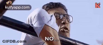 Man With Glasses Hanging On Bar Says No GIF