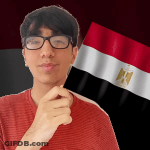 A Man Wearing Glasses Is Holding A Egyptian Flag In Front Of His Face GIF