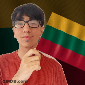 A Man Wearing Glasses Is Holding A Flag GIF