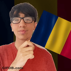 A Man Wearing Glasses Is Holding A Flag In Front Of Him GIF