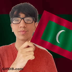A Man Wearing Glasses Is Holding A Green And Red Flag With A White Crescent Moon On It GIF