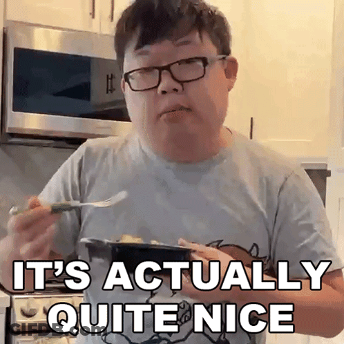 A Man Wearing Glasses Is Holding A Plate Of Food And Saying It 'S Actually Quite Nice GIF