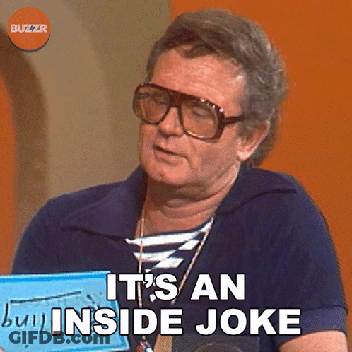A Man Wearing Glasses Is Holding A Sign That Says It 'S An Inside Joke GIF