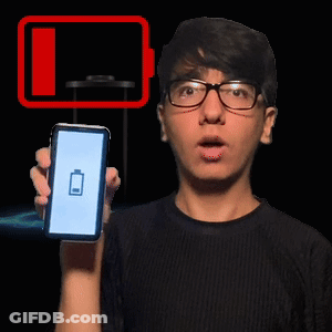 A Man Wearing Glasses Is Holding Up A Cell Phone With A Battery On The Screen GIF