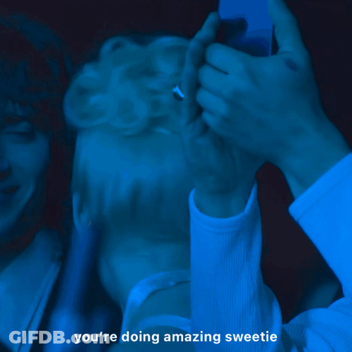 A Man Wearing Glasses Is Laughing With The Words You 'Re Doing Amazing Sweetie Behind Him GIF