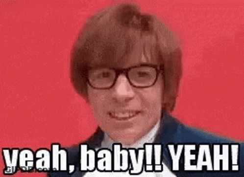 A Man Wearing Glasses Is Making A Funny Face And Saying Yeah Baby ! Yeah ! GIF