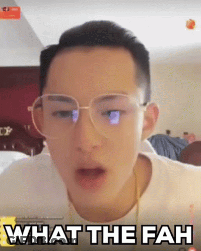 A Man Wearing Glasses Is Making A Funny Face And Says What The Fah GIF