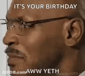 A Man Wearing Glasses Is Making A Funny Face . GIF