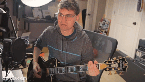 Man Playing Gibson Guitar With Glasses GIF