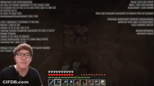 A Man Wearing Glasses Is Playing A Video Game On A Computer GIF