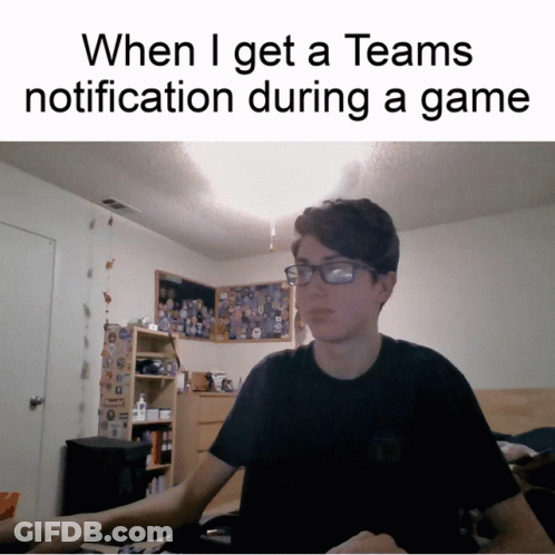 A Man Wearing Glasses Is Sitting At A Desk With A Caption That Says When I Get A Teams Notification GIF