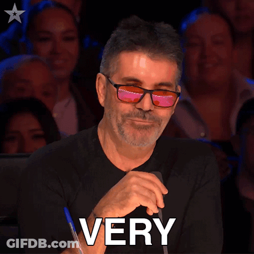 A Man Wearing Glasses Is Sitting In Front Of A Crowd And The Word Impressive Is On The Bottom GIF