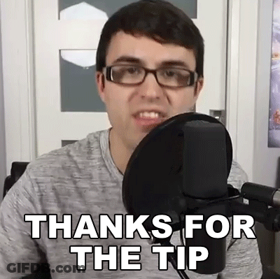 A Man Wearing Glasses Is Sitting In Front Of A Microphone And Saying Thanks For The Tip . GIF