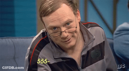 A Man Wearing Glasses Is Sitting On A Couch And The Number 555 Is On The Screen GIF