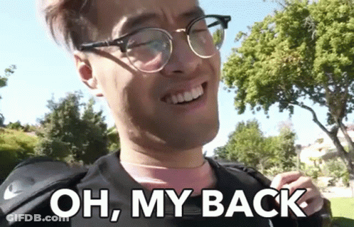 A Man Wearing Glasses Is Smiling And Says Oh My Back GIF