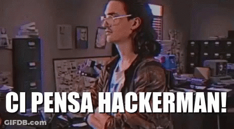 A Man Wearing Glasses Is Standing In An Office With The Words `` Ci Pensa Hackermani '' Written On The Bottom . GIF