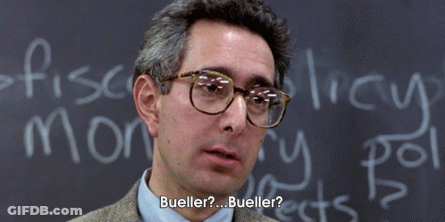 A Man Wearing Glasses Is Standing In Front Of A Chalkboard That Says Bueller GIF