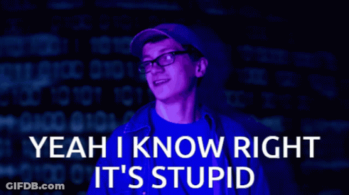 A Man Wearing Glasses Is Standing In Front Of A Computer Screen That Says Yeah I Know Right It 'S Stupid GIF