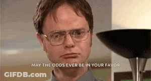 A Man Wearing Glasses Is Standing In Front Of A Lamp And A Lamp . GIF