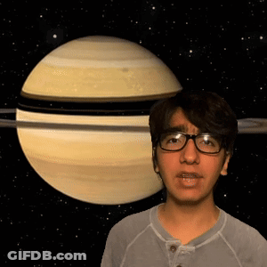 Man Wearing Glasses Standing In Front Of Planet GIF