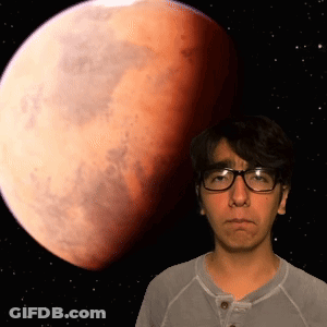 Man With Glasses In Front Of Red Moon GIF