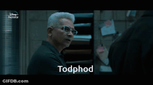 A Man Wearing Glasses Is Talking To Another Man And The Word Todphod Is On The Screen GIF