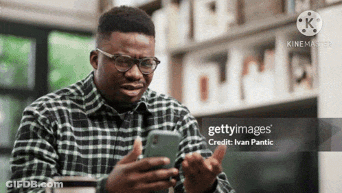 Man Wearing Glasses Using Cell Phone GIF