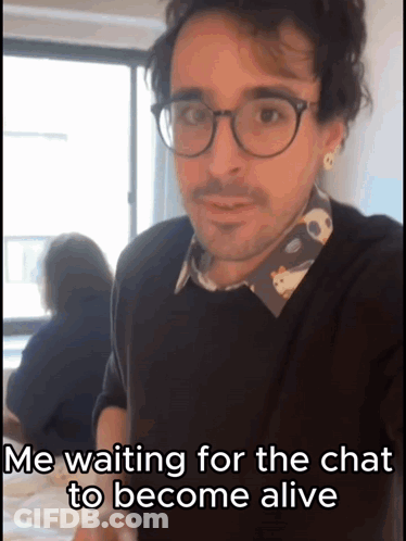 A Man Wearing Glasses Is Waiting For Someone To Become Alive GIF