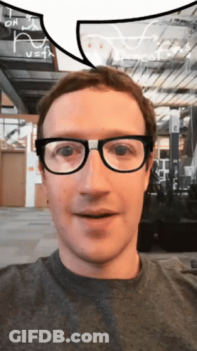 A Man Wearing Glasses Looks At The Camera With A Speech Bubble Above His Head GIF