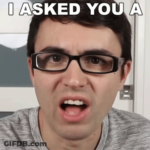 A Man Wearing Glasses Making A Funny Face With The Words I Asked You A GIF
