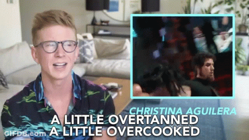 A Man Wearing Glasses Says Christina Aguilera A Little Over Tanned A Little Overcooked GIF