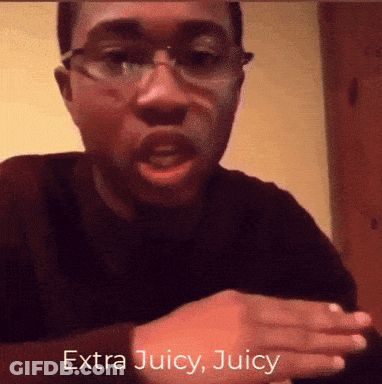 A Man Wearing Glasses Says Extra Juicy Juicy In Front Of His Face GIF