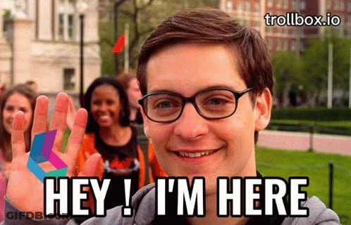 A Man Wearing Glasses Says Hey I 'M Here In Front Of A Group Of People GIF