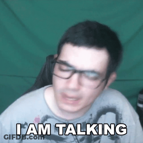 A Man Wearing Glasses Says " I Am Talking " GIF