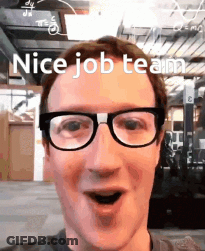 A Man Wearing Glasses Says " Nice Job Team " In Front Of A Building GIF