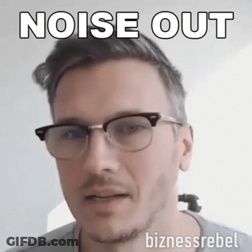 A Man Wearing Glasses Says Noise Out On The Bottom GIF