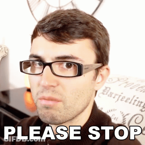 A Man Wearing Glasses Says Please Stop In Front Of A Wall With A Clock GIF