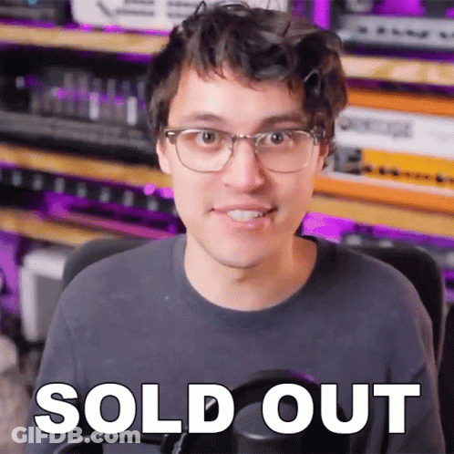 A Man Wearing Glasses Says Sold Out In Front Of A Purple Background GIF