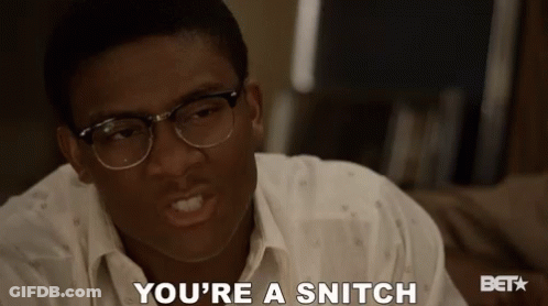 A Man Wearing Glasses Says " You 'Re A Snitch " GIF