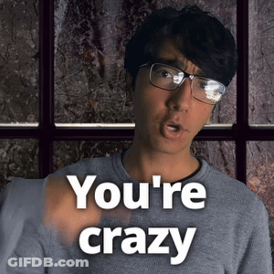 A Man Wearing Glasses Says You 'Re Crazy In Front Of A Window GIF