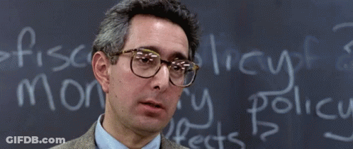A Man Wearing Glasses Stands In Front Of A Chalkboard That Says Bueller GIF