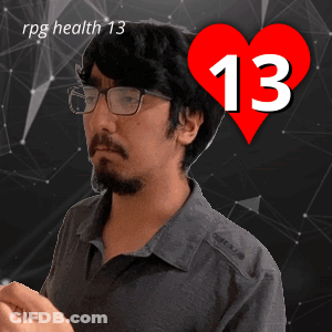 A Man Wearing Glasses Stands In Front Of A Heart With The Number 13 On It GIF
