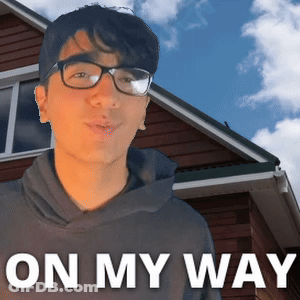 A Man Wearing Glasses Stands In Front Of A House With The Words " On My Way " Below Him GIF