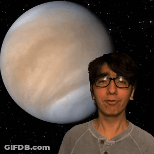 Man With Glasses In Front Of Large Planet GIF