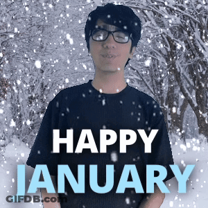 A Man Wearing Glasses Stands In Front Of A Snowy Forest With The Words Happy January Written Below Him GIF