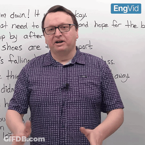 A Man Wearing Glasses Stands In Front Of A Whiteboard That Says " Kay " On It GIF