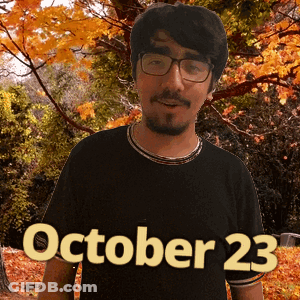A Man Wearing Glasses Stands In Front Of Trees With The Date October 23 GIF
